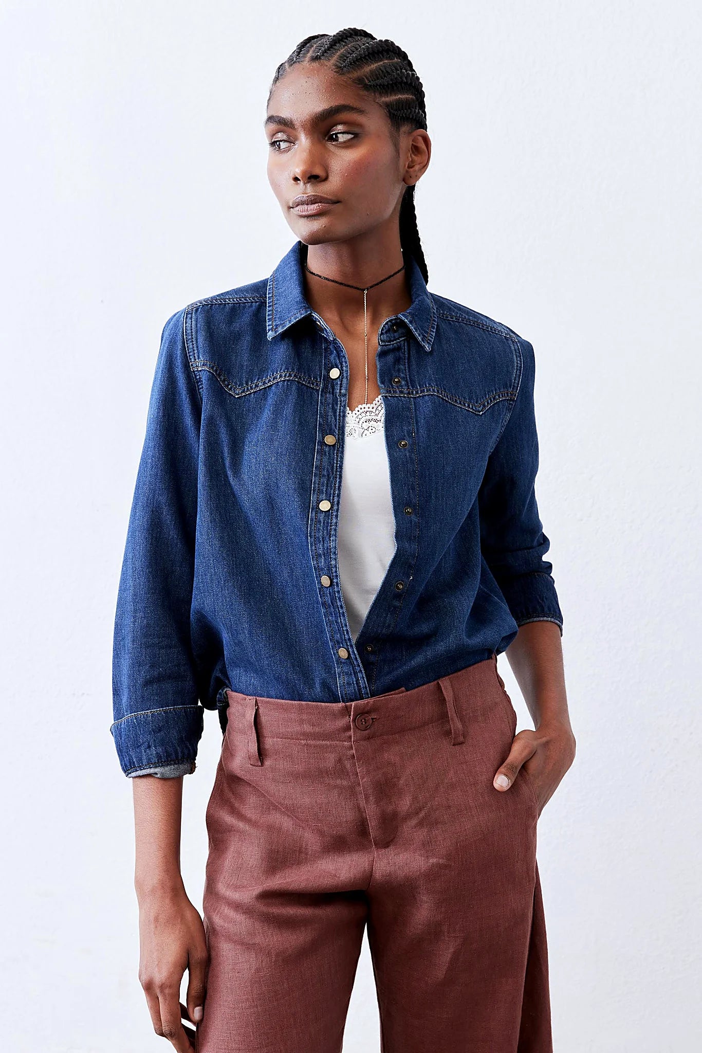 The subtly curved hem of the shirt