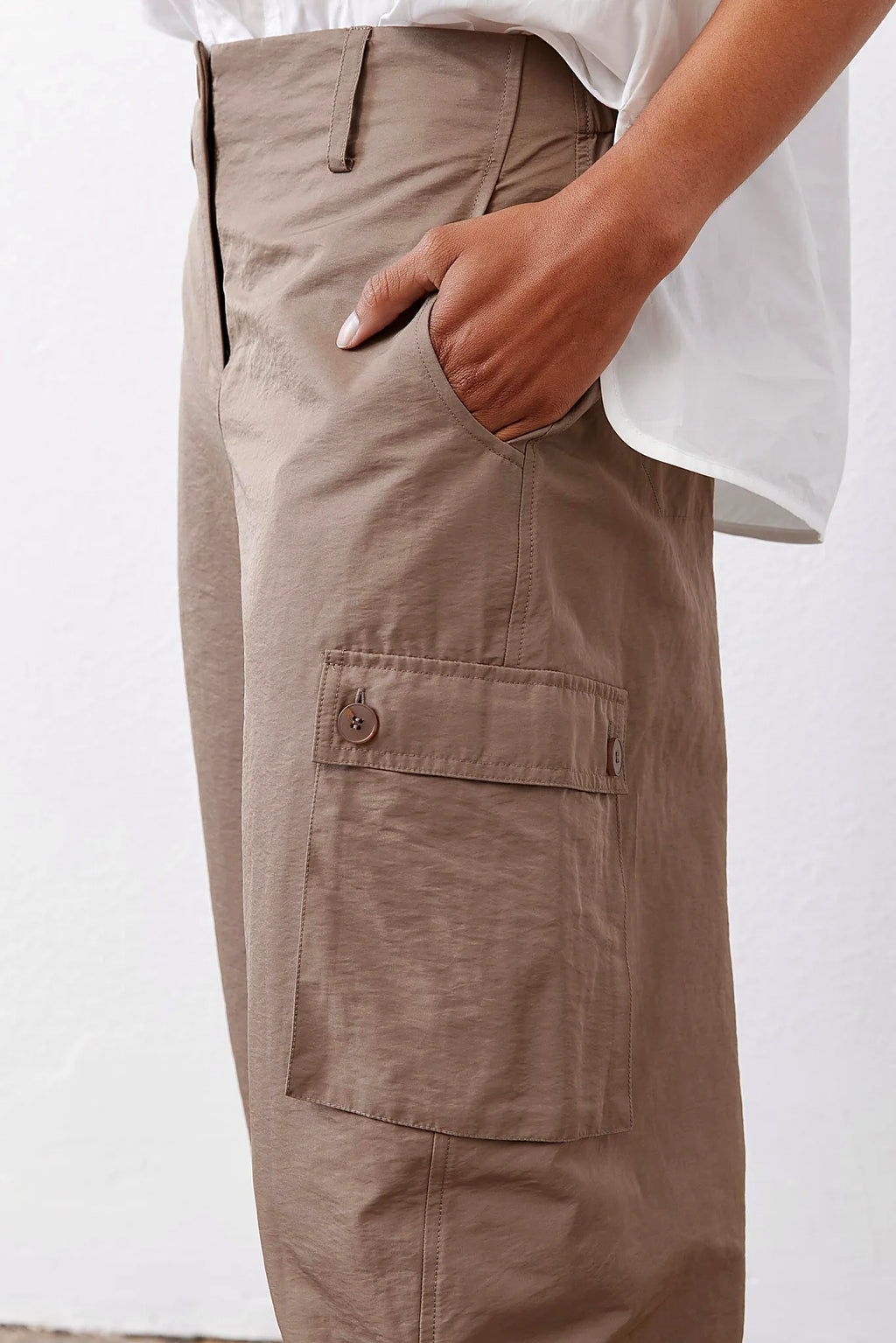 The curved barrel-leg silhouette from the side