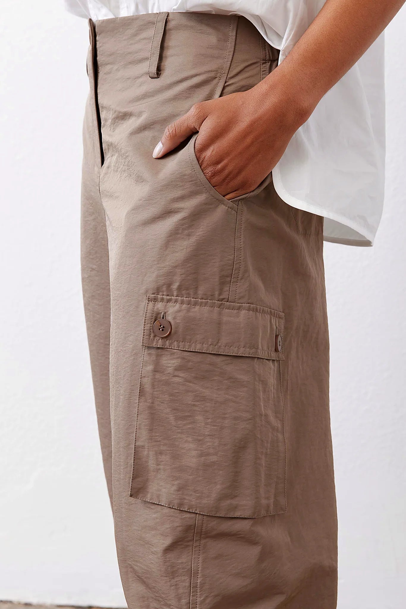 The curved barrel-leg silhouette from the side