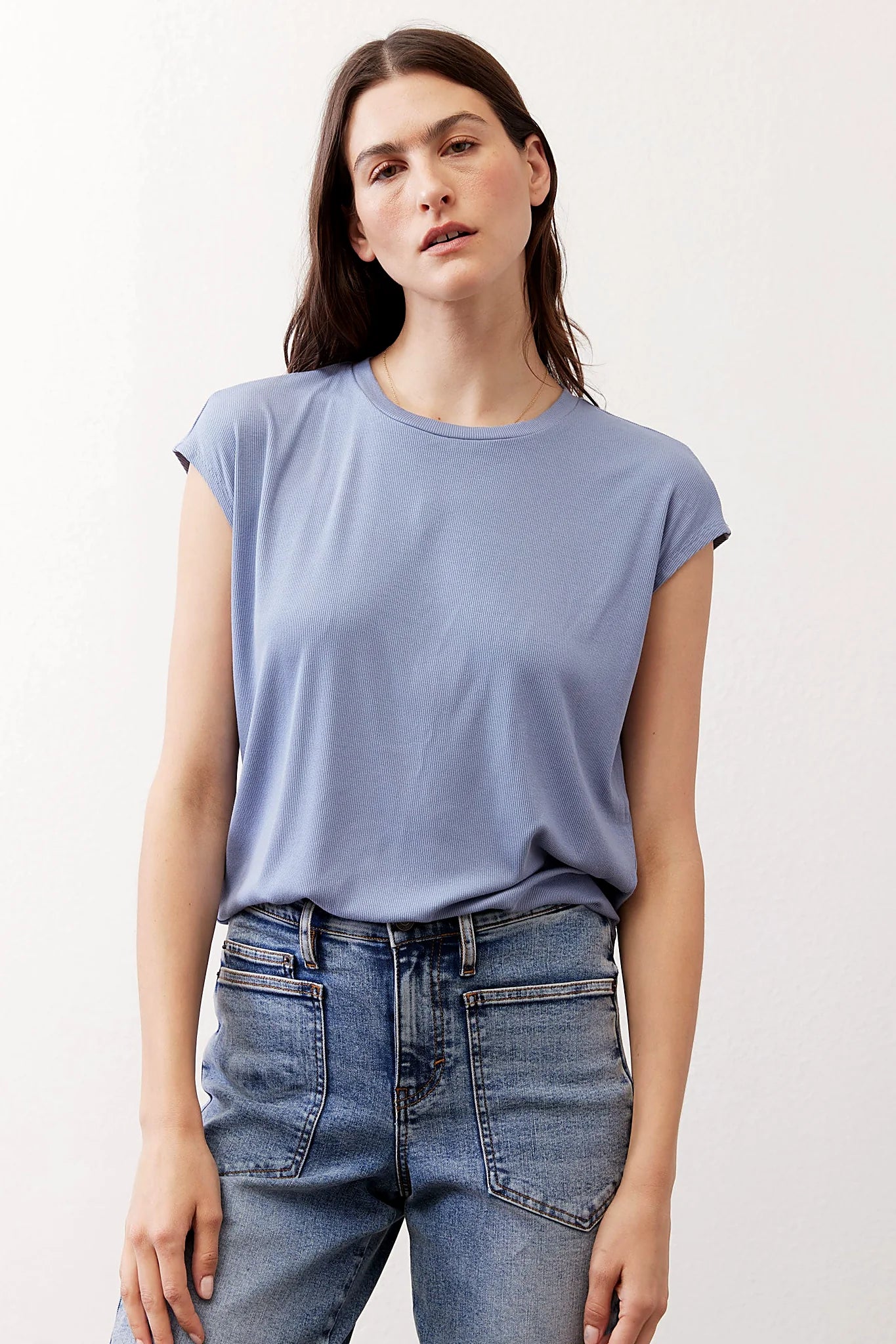 The tee shown half-tucked at the front