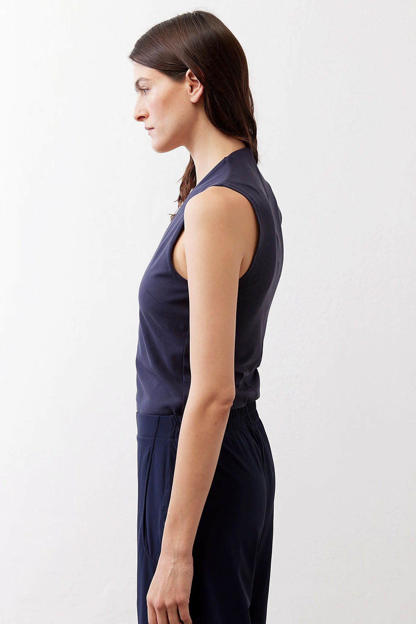 The sleeveless shoulder line of the tank
