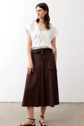 Brown utility skirt with front pockets, front view